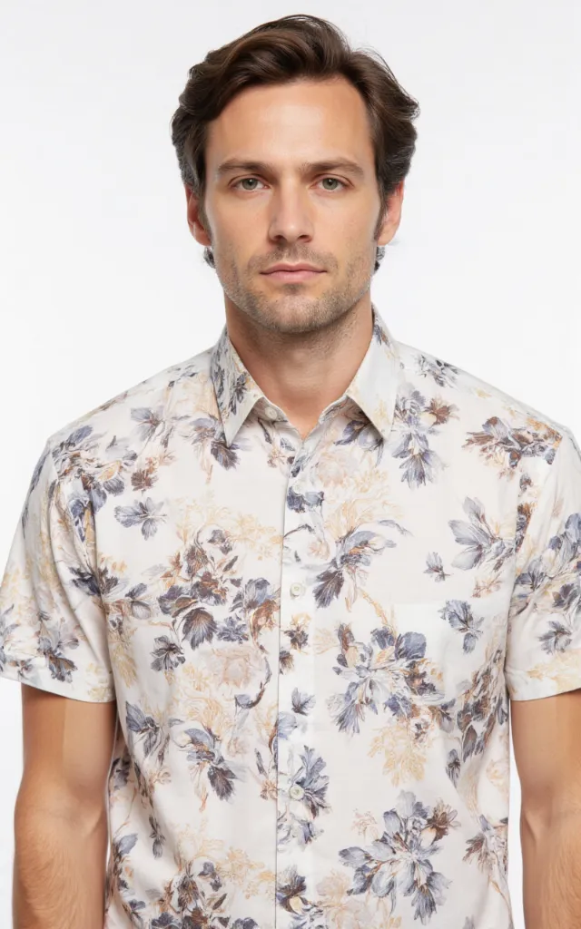 A French model wearing a Floral pattern   printed shirt, against a white background, in a front   facing bust portrait